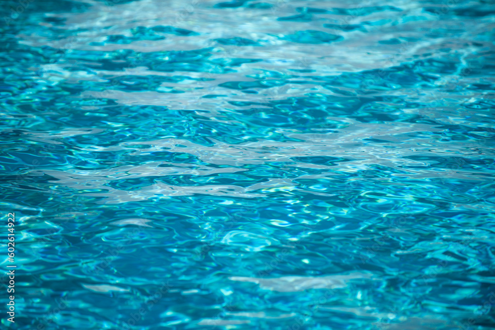 Blue ripped water in swimming pool, water pool texture and surface water backgraund.