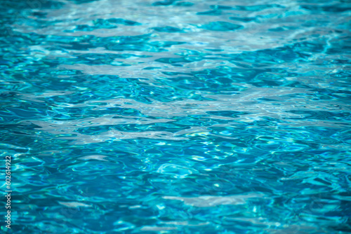 Blue ripped water in swimming pool, water pool texture and surface water backgraund.