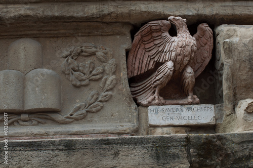 Relief of eagle on old wall in Piazza Neptune in Bologna