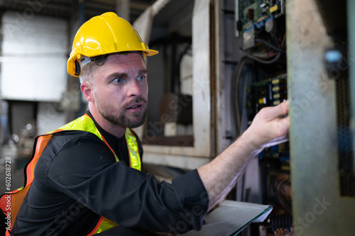 The engineer inspects the electrical system and repairs the mechanical system in the machine control cabinet. in order for the machine to return to normal operation