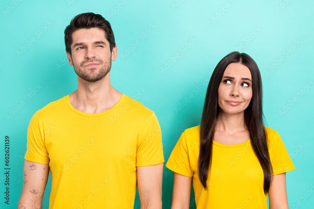 Photo of brainstorming young couple partners wear yellow t-shirt thinking  solution how save more money isolated on aquamarine color background Stock  Photo | Adobe Stock