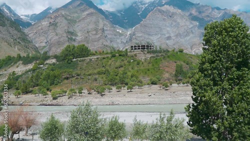 Confluence of Chandra and Bhaga rivers gives birth to Chenab river in Tandi, Lahaul and Spiti district, India. Beautiful landscape view of confluence of Himalayan rivers in Lahaul during summer day. photo