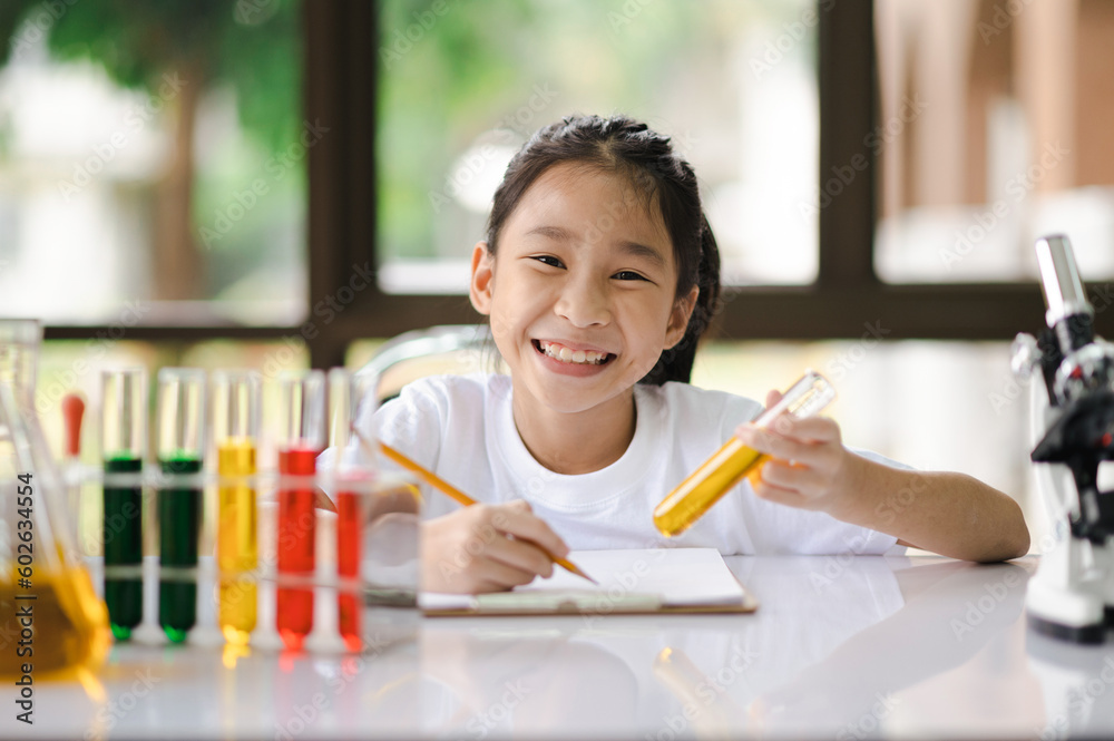 Asian girls having fun experimenting with science. Asian girls having fun experimenting with science.