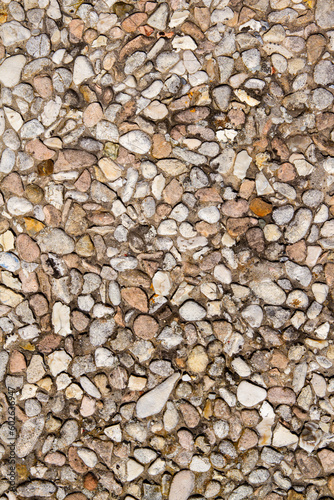 A sidewalk of small stones. Fine pebble texture.
