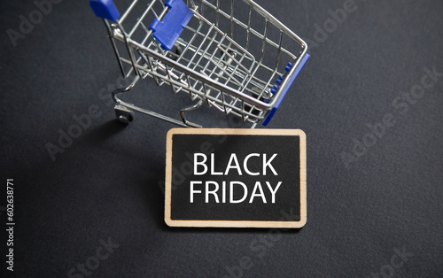 Shopping cart on the black background. Black Friday