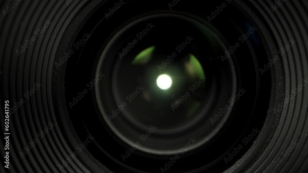 the front lens of the camera lens, and the light inside. Dolly slider extreme close-up.