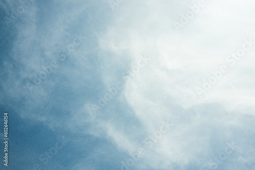 Fototapeta Naklejka Na Ścianę i Meble -  White clouds on blue sky  in retro style with grain