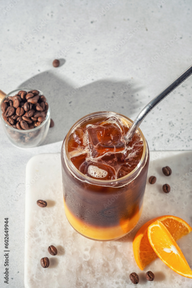 Bumble coffee mix with orange juice and cold brew coffee with ice. Summer trendy refreshing coffee drink. Bumble coffee mix with orange juice and cold brew coffee with ice. Summer trendy refreshing coffee drink.