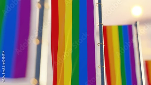 Loop of a Gay Pride flag waving in the wind during sunset