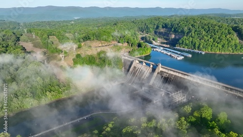 Valokuva Norris Dam in Tennessee mountains at early morning sunlight beneath misty fog an