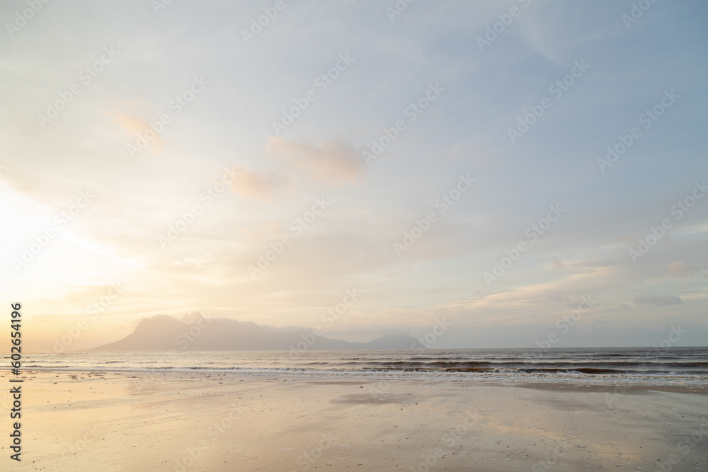 Obraz premium Bako national park, sea sandy beach, overcast, cloudy sunset, sky and sea, low tide. Vacation, travel, tropics concept, Malaysia