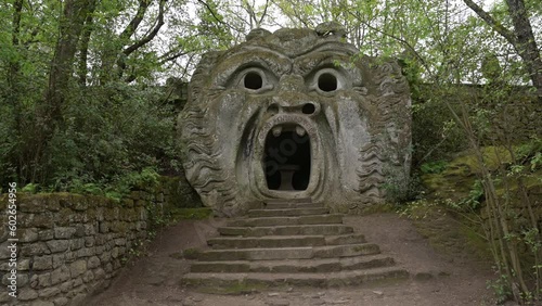 The ancient statue representing the ogre, in the park of monsters in Bomarzo, Italy photo