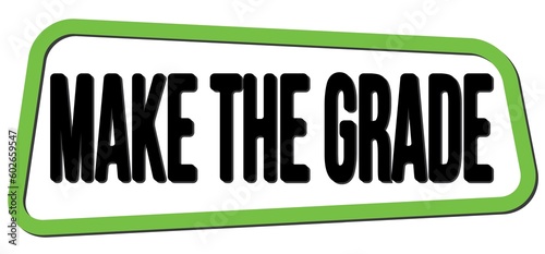 MAKE THE GRADE text on green-black trapeze stamp sign.