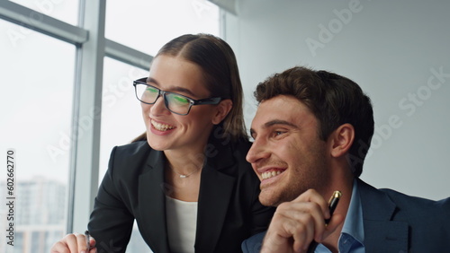 Two business partners checking report closeup. Smiling mentor helping employee