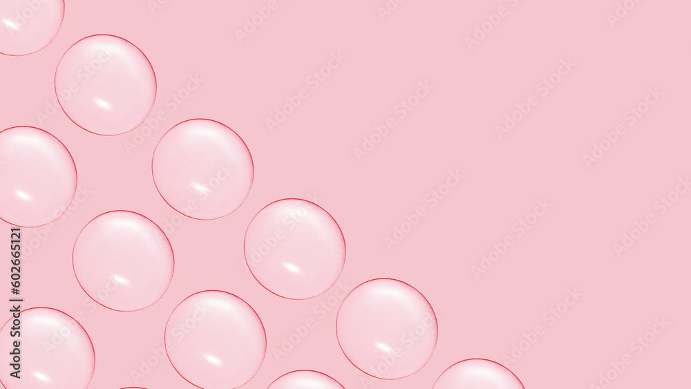 Drops of clear gel or water in rows. On a pink background.