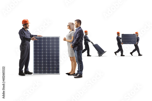 Obraz na plátně Factory worker with a solar panel talking to customers
