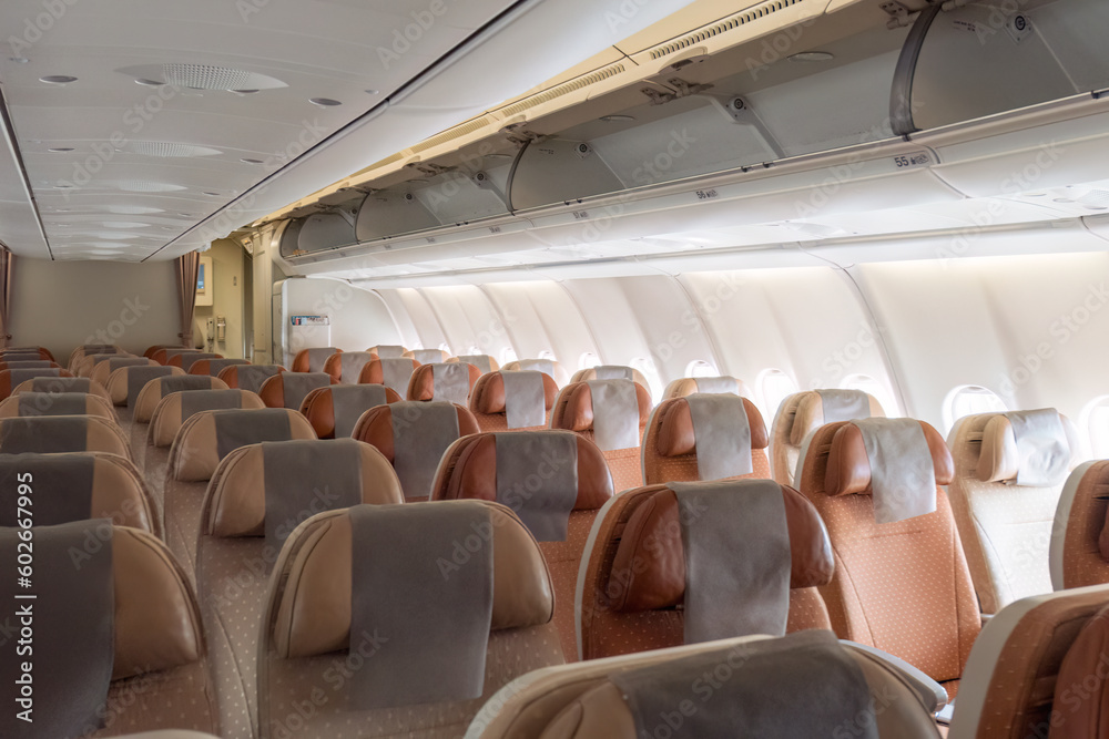 Fototapeta premium Commercial aircraft passenger seat and aisle cabin