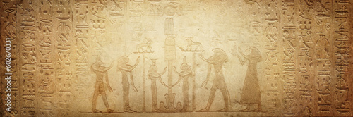 Gods of ancient egypt and old Egyptian hieroglyphs on ancient background. Wide historical background. Ancient Egyptian hieroglyphs as a symbol of the history of the Earth.