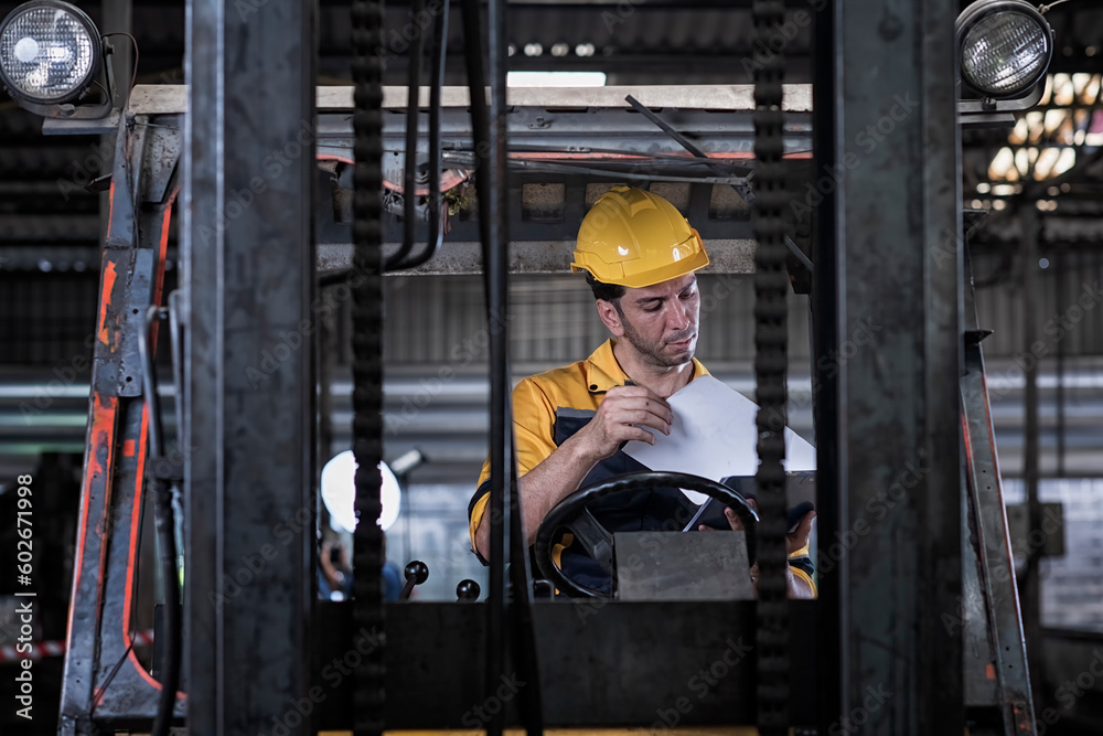 worker in warehouse. Caucasian male worker working in warehouse goods store. inventory staff moving product pallet shipping management with folk lift truck.