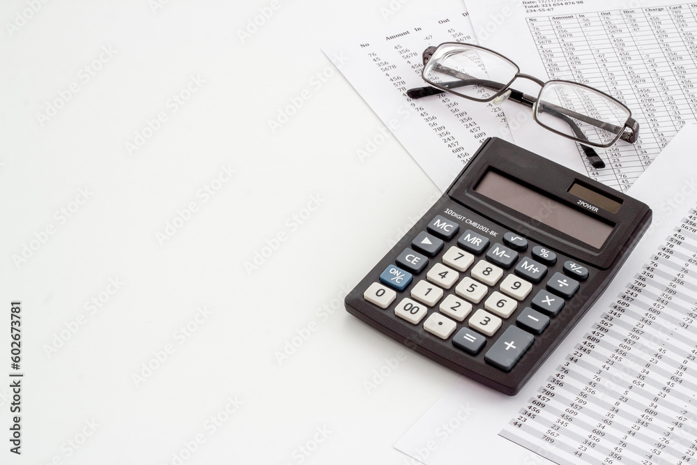 Office table with financial accounting and business planning with calculator
