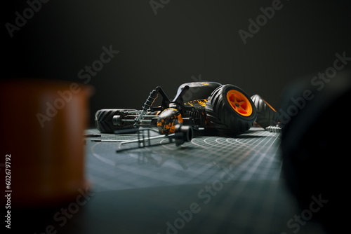 Quadro em tela Disassembled remote-controlled car laying on a cutting mat with parts around