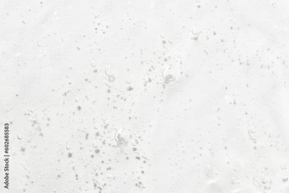 The texture of the serum or gel. Transparent cream with bubbles in the background. Transparent cosmetic gel in close-up. .Oxygen bubbles. . The texture of the serum or gel. Transparent cream with bubbles in the background. Transparent cosmetic gel in close-up. .Oxygen bubbles. .