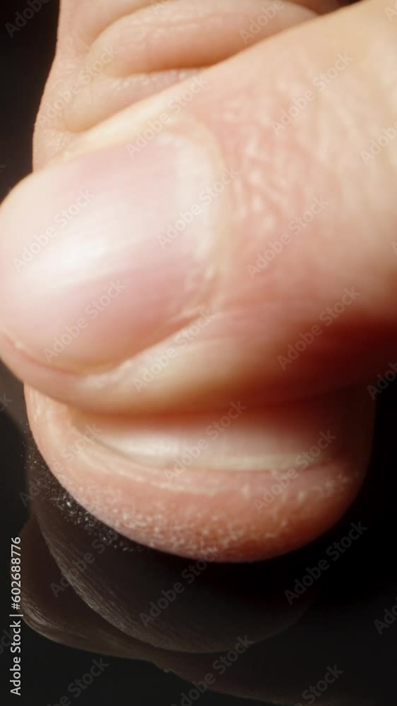 Fingerprinting against a black background, close-up shot. Vertical video. Fingerprinting against a black background, close-up shot. Vertical video.