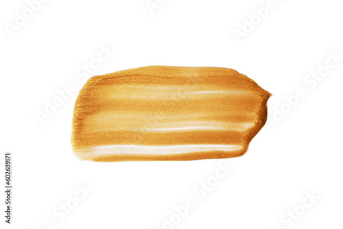 A dab of gold paint on a white background.