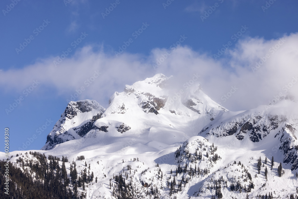 Sky Pilot Mountain covered in Snow. Canadian Landscape Nature Background. Squamish, British Columbia, Canada. Sunny Day