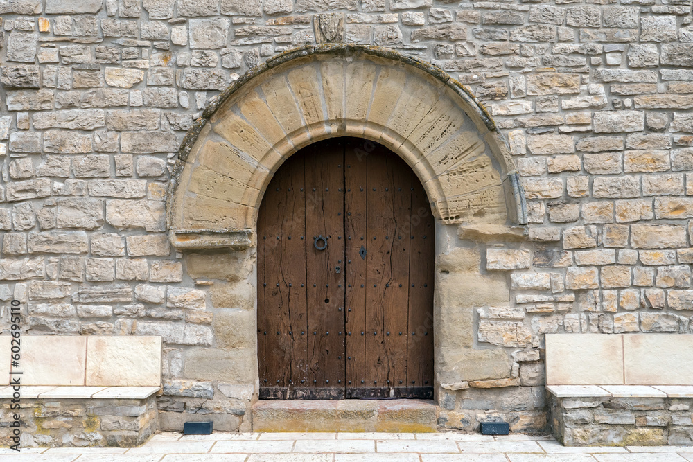 L'Astor (Anoia), Catalunya, Spain - May 14, 2023: Front door of Santa Magdalena Church L'Astor (Anoia), Catalunya, Spain - May 14, 2023: Front door of Santa Magdalena Church