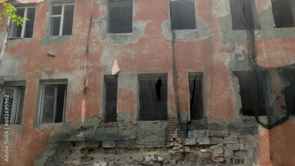 Ruins of a very heavily old abandoned apartment building. Ghetto derelict street. Ruins of a very heavily old abandoned apartment building. Ghetto derelict street.