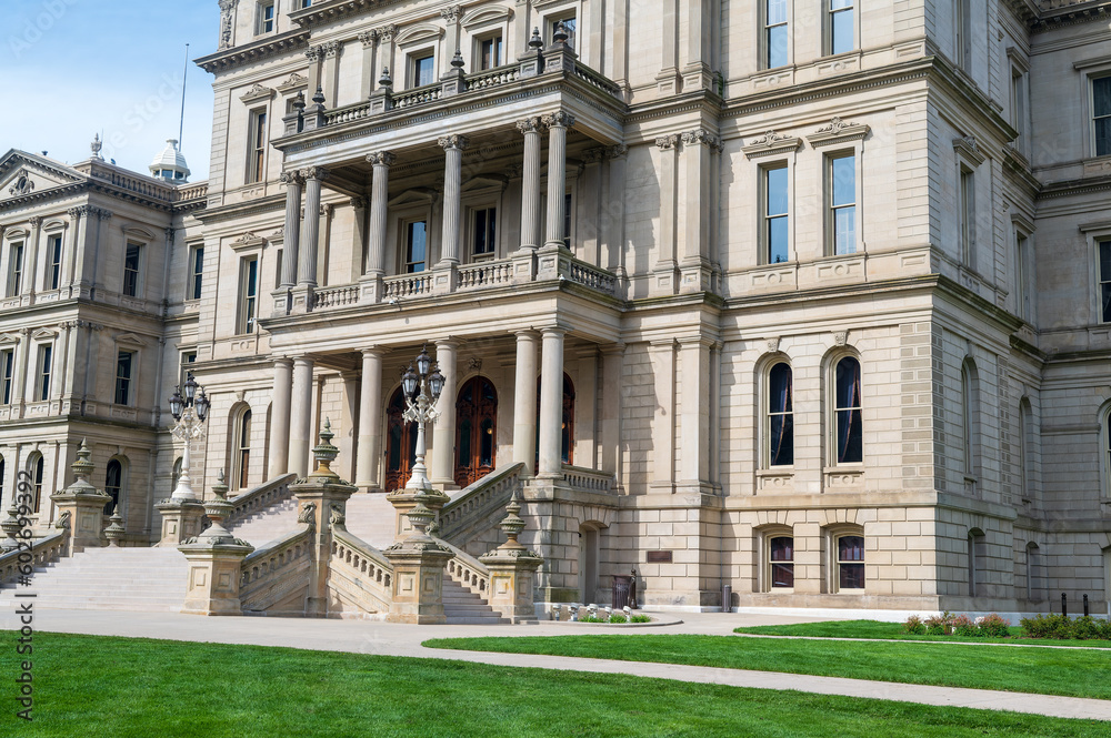 Lansing MI - May 6, 2023: Main entrance to the Michigan Capitol building with ornate masonry and lamppost