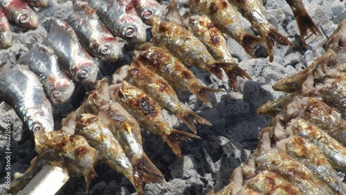 Sardines espetos grilled at fire, typical spanish food