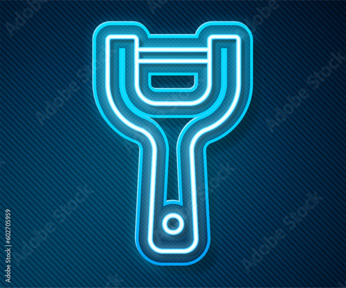 Glowing neon line Vegetable peeler icon isolated on blue background. Knife for cleaning of vegetables. Kitchen item, appliance. Vector