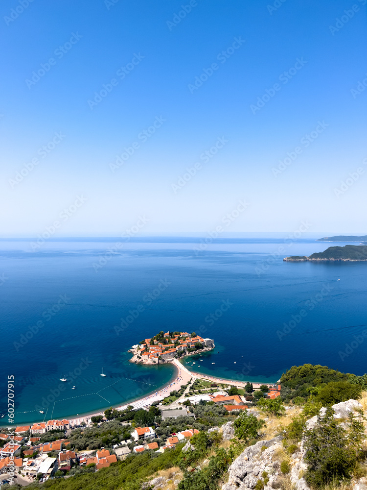 View from the mountain to the island of Sveti Stefan near the coast of a small town. Montenegro