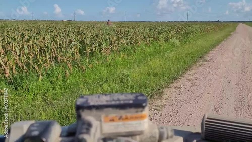 People riding quad bike through a field, atv moto