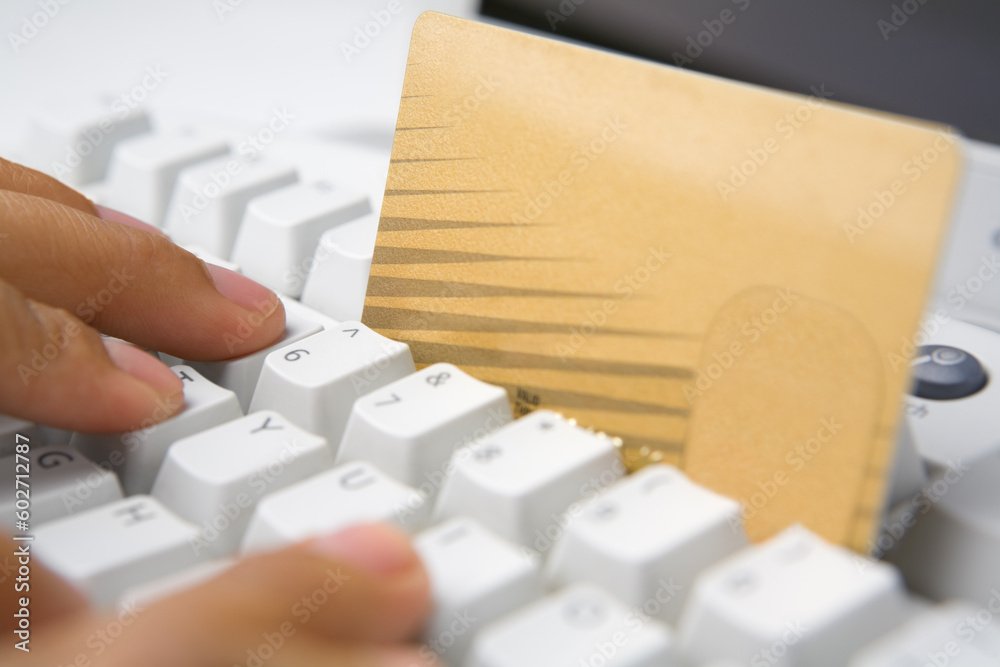 Picture of using gold credit card for online transaction Picture of using gold credit card for online transaction