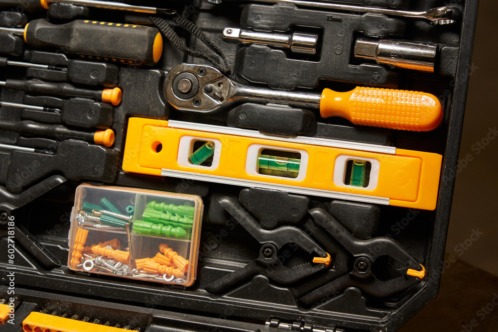 small liquid level, ratchet screwdriver, replaceable bits, fasteners, clamps, clamps in a suitcase with a bench tool small liquid level, ratchet screwdriver, replaceable bits, fasteners, clamps, clamps in a suitcase with a bench tool