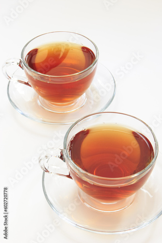 Two glass cups with hot tea