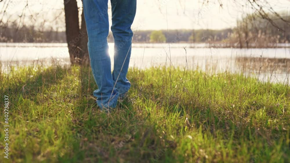 hiker man feet walking in park forest. travel concept. close-up of a leg man walking with a in the park in the forest. man walk journey concept. hiker sneakers walking park close-up hiker man feet walking in park forest. travel concept. close-up of a leg man walking with a in the park in the forest. man walk journey concept. hiker sneakers walking park close-up