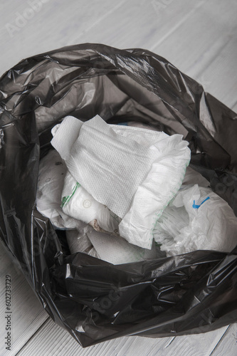 Garbage bag with waste, plastic and diapers close-up. Environment, ecology, zero waste.