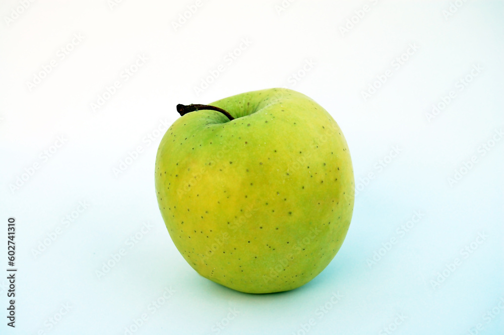 Fresh green apple with water droplets against a white background. For web & graphic design. Fresh green apple with water droplets against a white background. For web & graphic design.