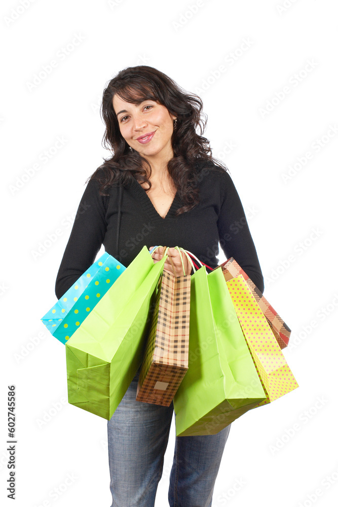 A woman holding several shopping bags, isolated on white background A woman holding several shopping bags, isolated on white background