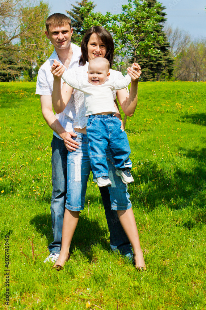 Parents playing with their son in the park