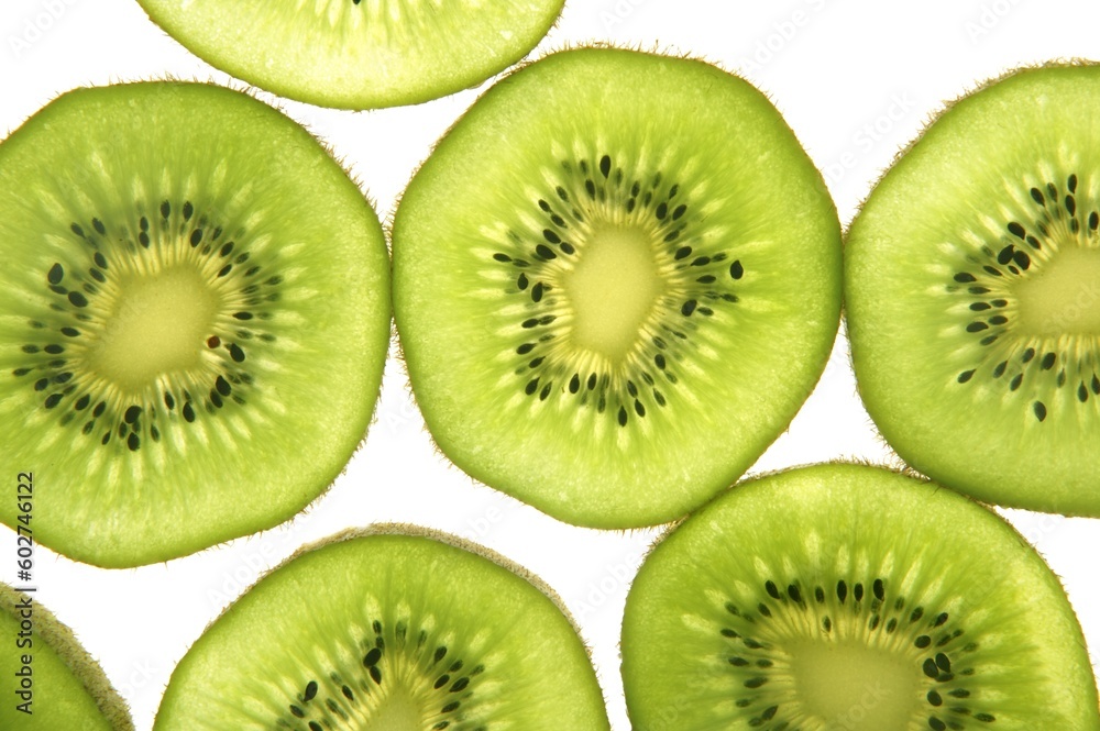 Kiwi green transparent slices over white background Kiwi green transparent slices over white background