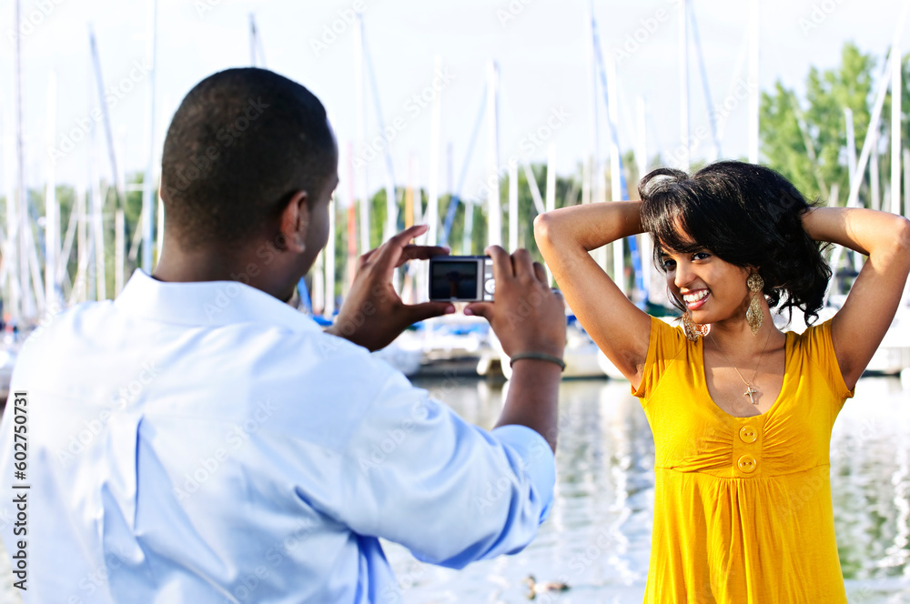 Beautiful woman posing for vacation photo at harbor Beautiful woman posing for vacation photo at harbor