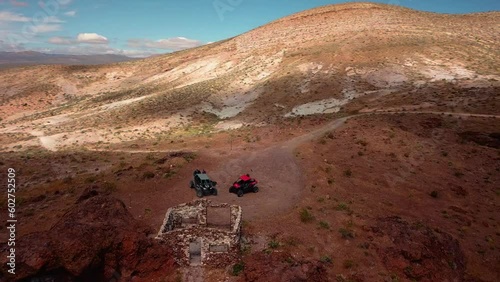 UTV driving on a dirt trail in the desert photo