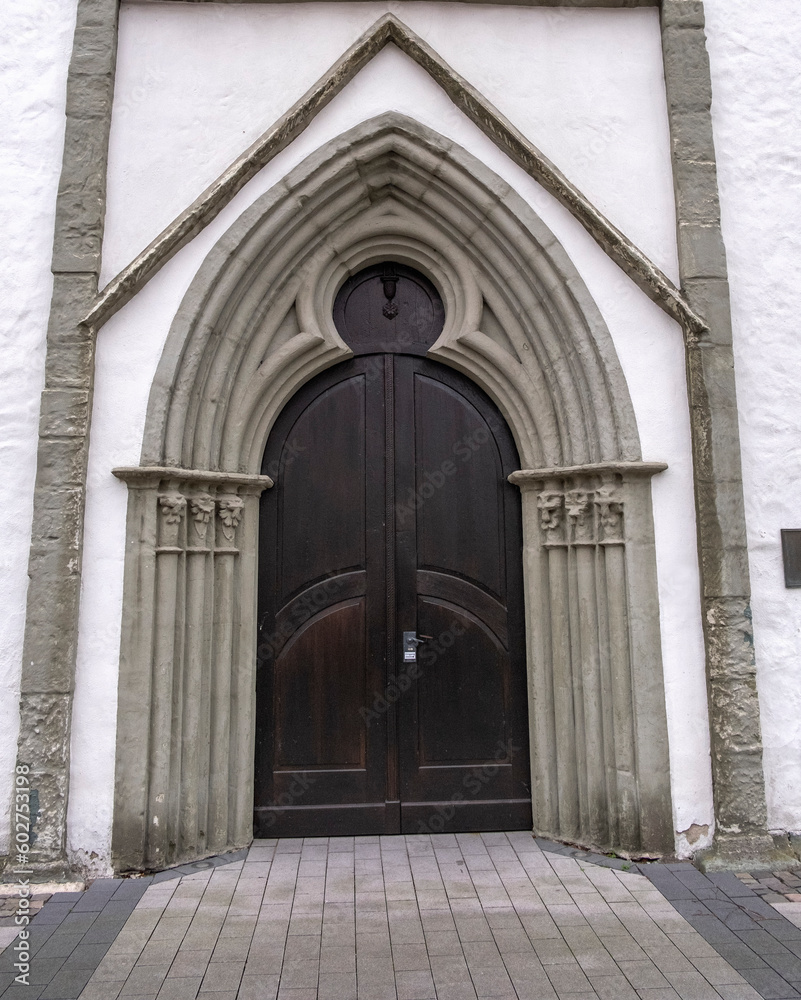 White church ,architecture ,door, facade ,wall background in the old town of lippstadt germany