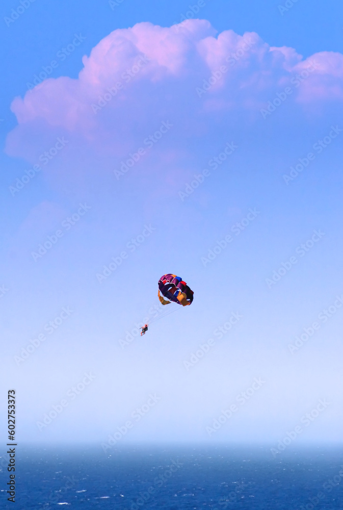 Couple in air, paraglider