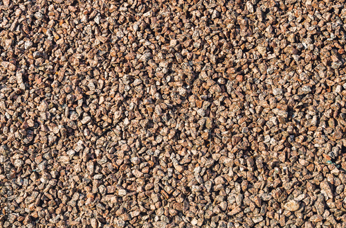 Brown small rubble. Stone gravel texture. Background. Top view close-up.